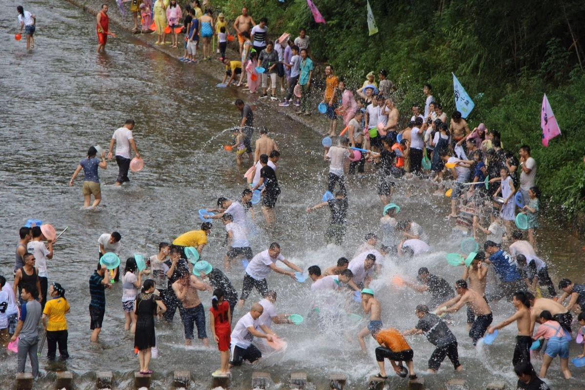 Visitors celebrating Songkran with water activities in Thailand