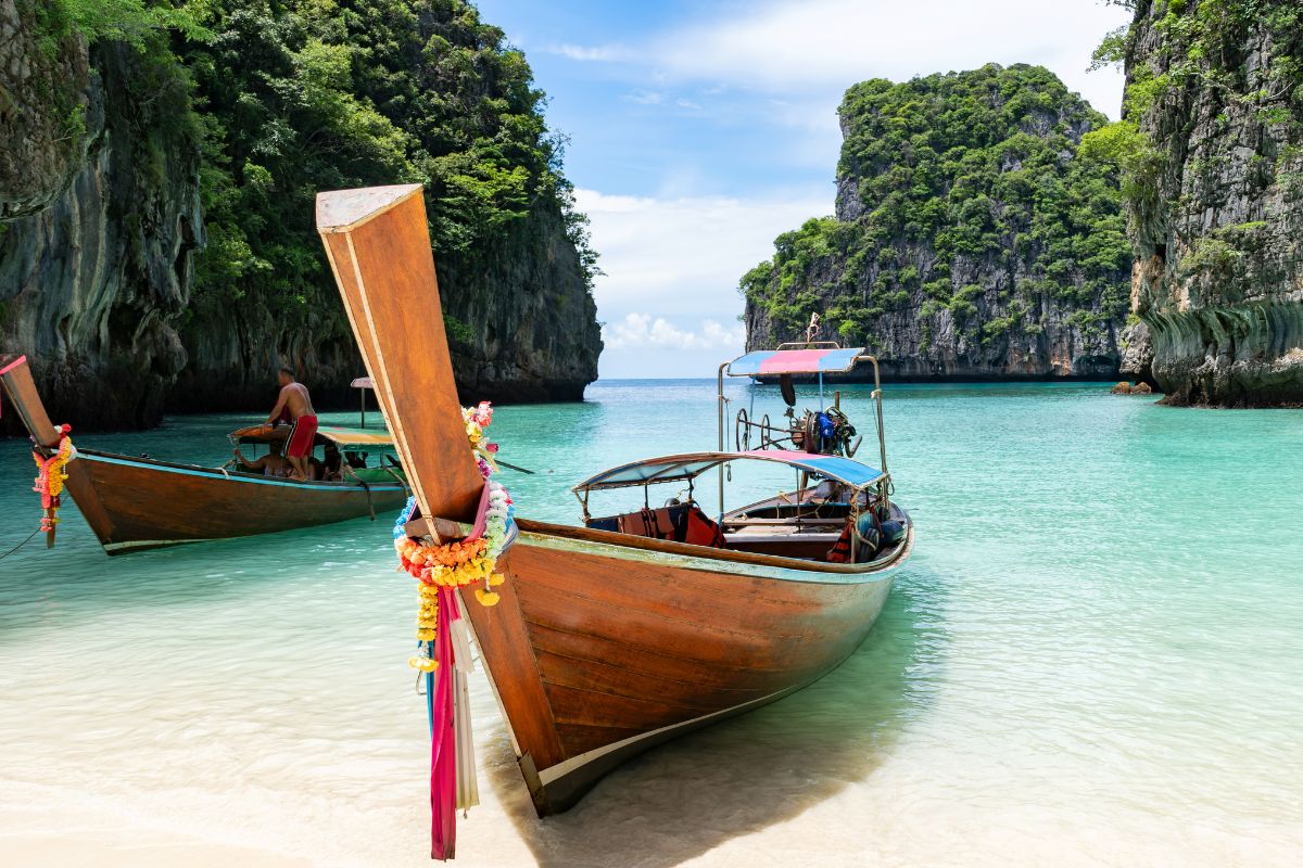 Traditional long-tail boat on a beach in Phuket, Thailand