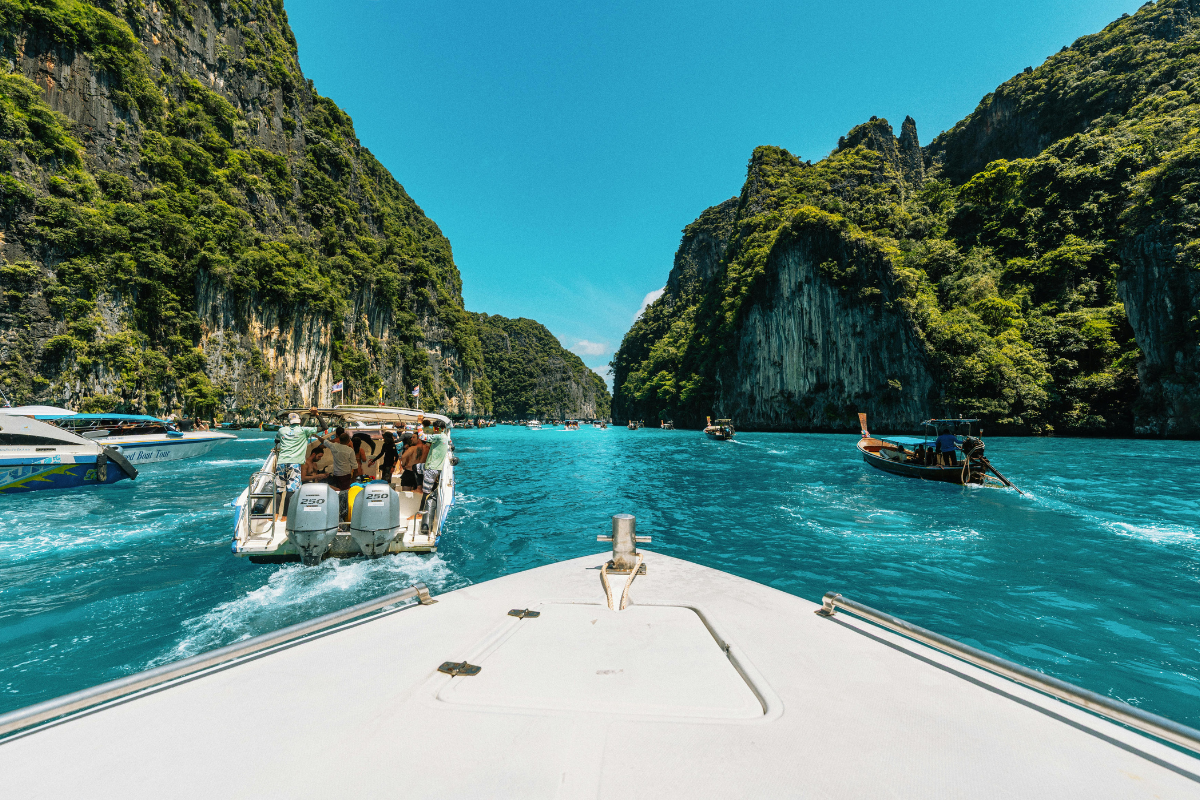 White sandy beach with crystal-clear turquoise water in Thailand