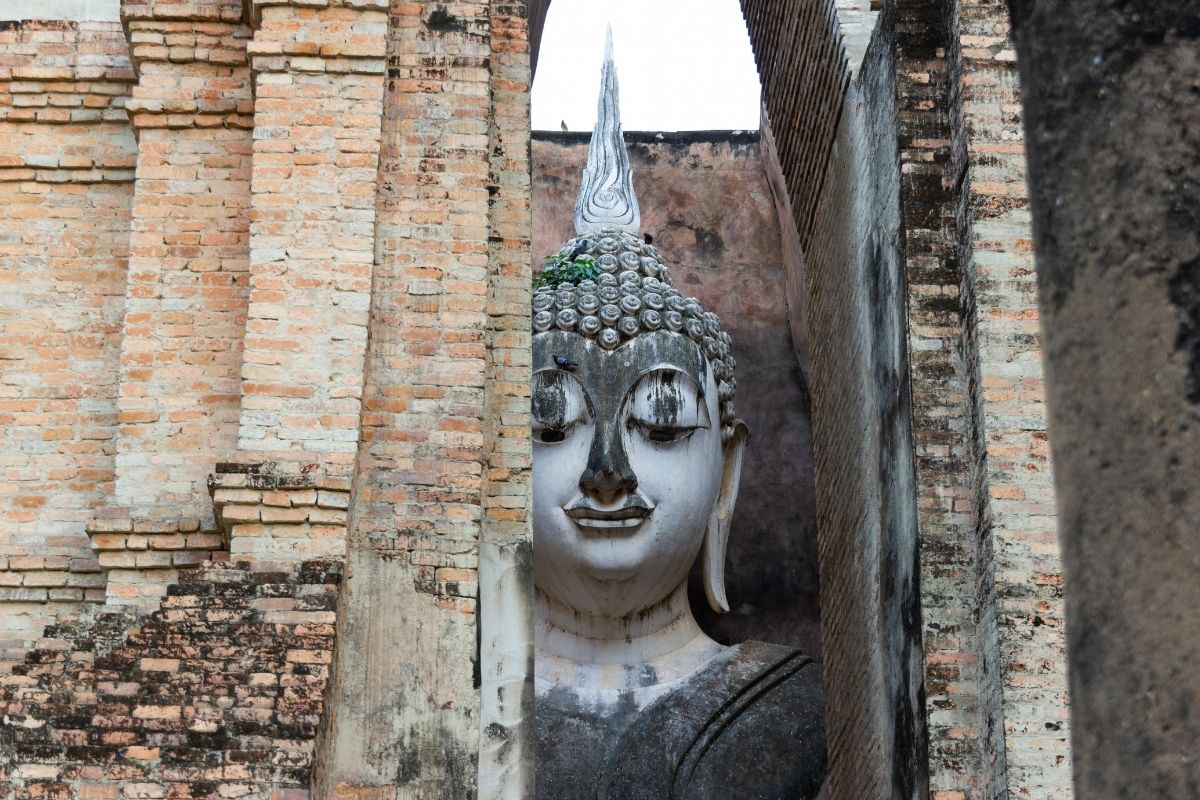 Ancient Buddha statue at Wat Si Chum in Sukhothai Historical Park, Thailand