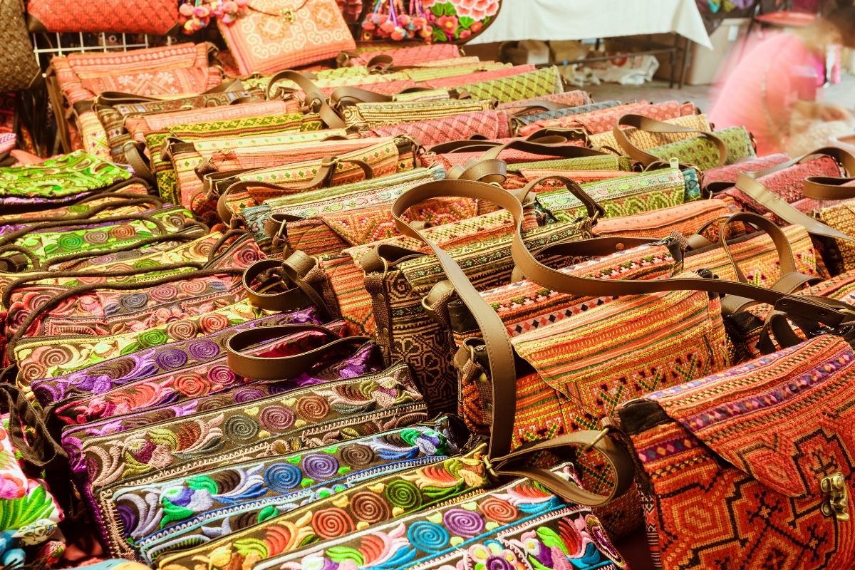 Colorful handmade bags at a local market in Chiang Mai, Thailand