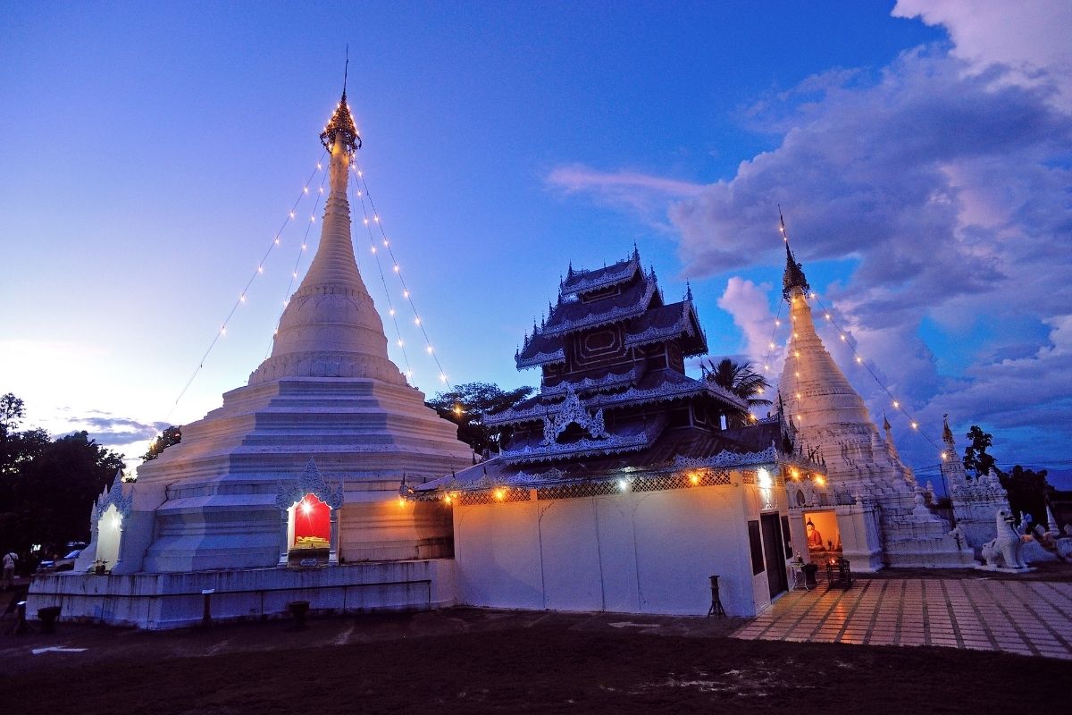Wat Phra That Doi Kong Mu overlooking Mae Hong Son at sunset, Thailand